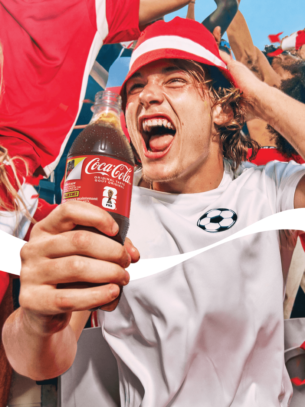 A person with a Coca-Cola® bottle